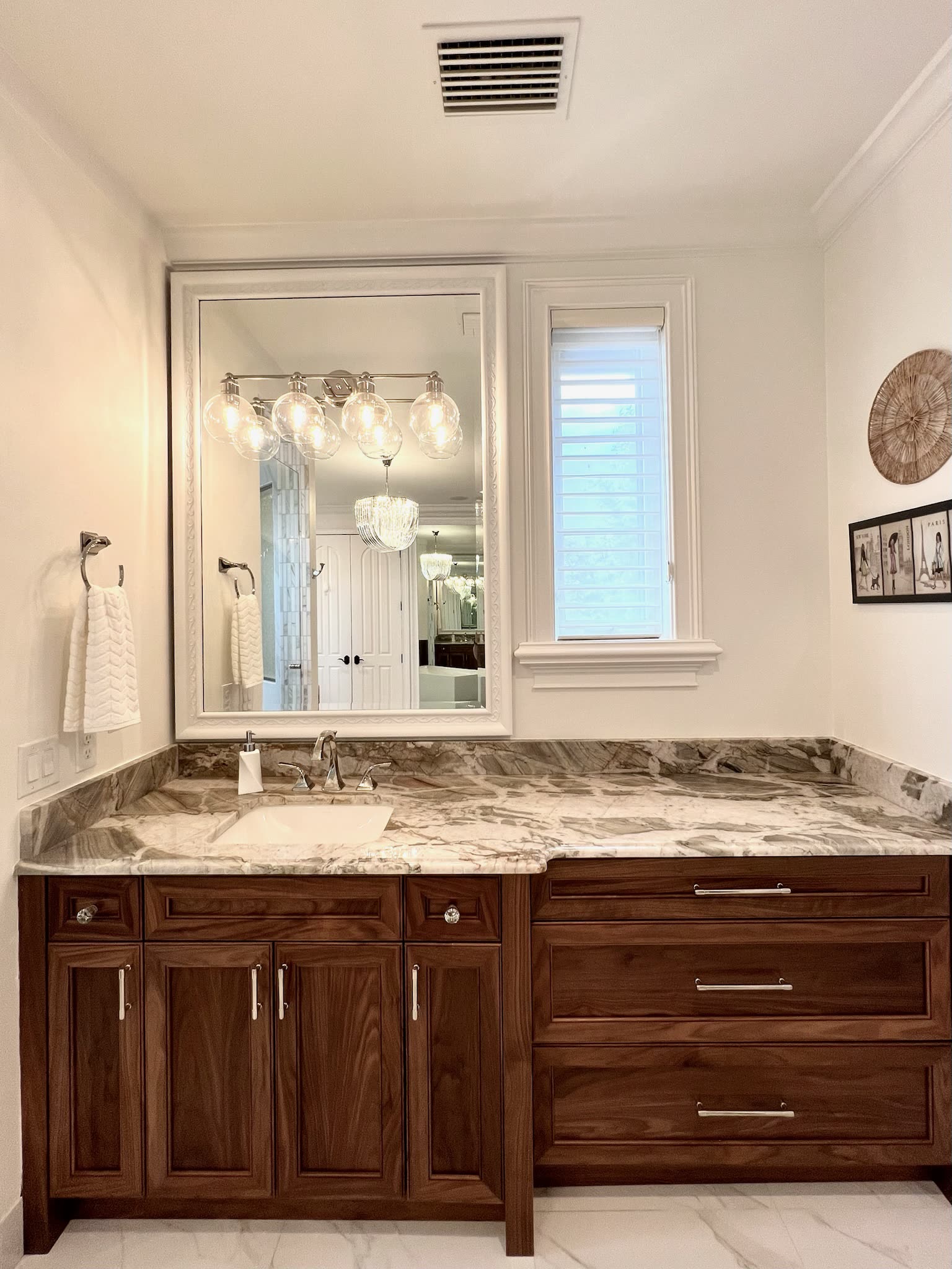 Walnut vanity with book-matched stone counter