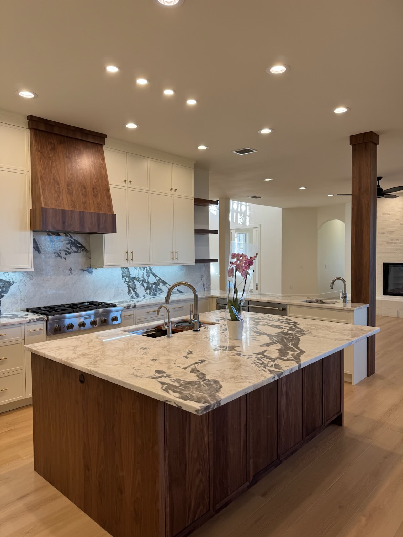 Walnut island with waterfall stone and prep sink