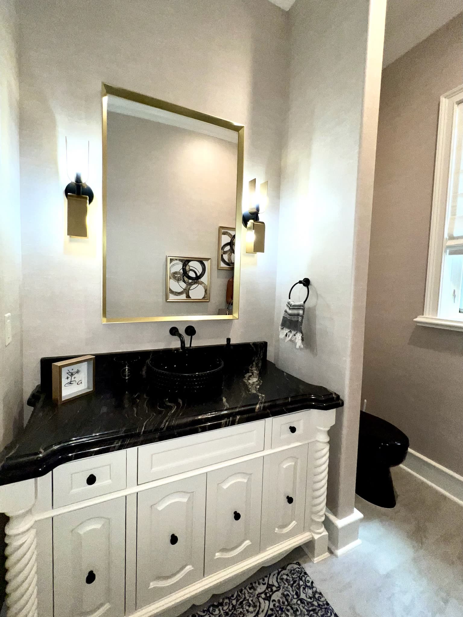 Detail of a guest bath vanity and lighting